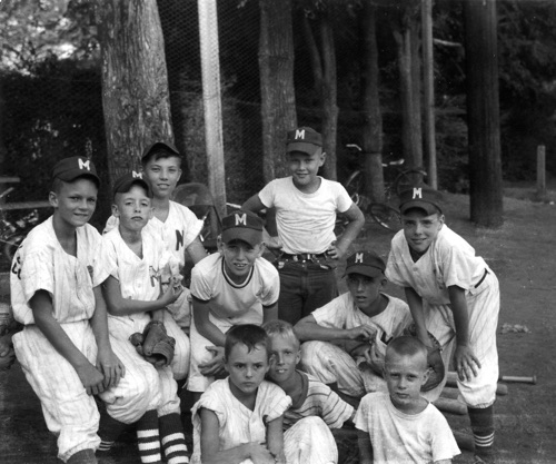 Montevallo Little Leaguers prior to a game at the baseball diamond behind the high school. They were coached by Theron Fisher. Left to right: Ed Simpson, Clay Nordan, James Lumpkin, Joe Meyer, Roy Starks, George White, Joe Lovelady, Jimmy Birdsong, Danny Wyatt, Bonard Hamric. 